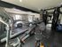 Fully equipped fitness center at Trailwood Village Apartments in Kingwood, TX, featuring Life Fitness treadmills, ellipticals, and cable weight machines.