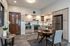 Modern apartment kitchen with sleek cabinetry, stainless steel appliances, and an inviting dining table.