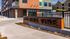 Stylish modern apartment building exterior with 'One Nine Vine' signage.