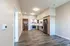 Bright and spacious kitchen with stainless steel appliances and wooden cabinetry.