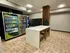 Modern communal space featuring convenient vending machines and sleek package lockers, perfect for residents.