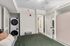Furnished bedroom with in-unit washer and dryer