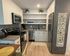 Kitchen with included furnishings