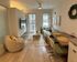 Furnished unit living and dining spaces
