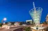 College Town, exterior, night, property all lit up. funnel sculpture