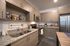 College Town, interior, kitchen, wood table, wood cabinets, stainless steel appliances, refrigerator, microwave, stove/oven