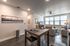 College Town, interior, dining room, living room, wood table, chairs for 3, wall art, garbage can, sofa, arm chair, area rug, large windows, tv