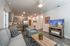 College Town, interior, living room, tv, gray sofa and arm chair, area rug, coffee table, end table, lamp, dining room, chairs and table for 3, front door, kitchen, stainless steel, refrigerator, dishwasher, microwave, stove/oven, wood cabi