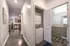 College Town, interior, hallway to kitchen, closet, laundry closet, stacked washer/dryer, bathroom,