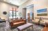 College Town, interior, main lobby, seating areas, large window, wall art, brown, tan and black leather seating, gray and white area rugs