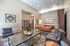 College Town, interior, seating area, gray, tan and brown leather seating, coffee table, white and gray area rugs, book shelf, mail boxes