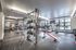 College Town, interior, fitness center, weights, large windows, elliptical, treadmills