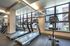 College Town, interior, fitness center, large windows, bike, treadmills