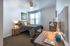 College Town, interior, bedroom, bed, desk, chair, dresser, night stand, lamp, wall art, window
