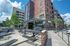 College Town, exterior, outdoor seating, metal picnic tables, red brick building, multi level, palm trees,