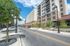 College Town, exterior, street, sidewalk, red brick and white buildings, cars, trees
