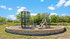 Charming outdoor playground with a slide and climbing structure surrounded by lush greenery and a clear blue sky.
