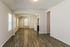 Inviting open-concept living space with elegant hardwood floors and abundant natural light.