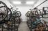 Secure indoor bike storage room featuring modern racks and a variety of bicycles, perfect for active urban living.