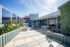 Inviting rooftop terrace with modern outdoor furniture, lush greenery, and expansive views, perfect for relaxation and entertainment.