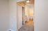 Inviting ensuite bathroom with modern fixtures and soft carpeting, perfect for comfort and style.