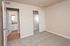 Inviting bedroom with plush carpet, leading to an elegant bathroom and spacious walk-in closet.