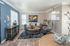 Chic and inviting living room with modern furniture, elegant decor, and abundant natural light, perfect for relaxation and entertainment.