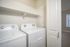 Bright and functional laundry room with modern washer and dryer, enhancing daily convenience.