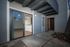 Charming apartment entrance with sliding glass doors and a covered patio, leading to a bright and inviting open living space.