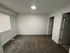 Bright and inviting bedroom with plush carpet, ample natural light, and modern design.