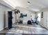 Bright and spacious gym with modern exercise equipment, sleek flooring, and stylish decor for an invigorating workout experience.