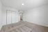 Bright and inviting room with plush carpet and ample closet space, perfect for cozy living.