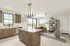 Bright, modern open-concept living area with a sleek kitchen island, stylish chandelier, and expansive windows overlooking scenic views.