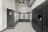 Modern mailroom featuring sleek Luxer One package lockers and organized mail slots, showcasing efficient and secure package management.