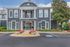Elegant Jefferson Apartment building entrance with landscaped gardens and classic architecture.