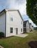 The Collective at Kennesaw Cottage Back Exterior with Yard