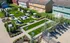 Inviting outdoor community area featuring lush green lawns, picnic tables with umbrellas, and perfect spaces for relaxation and social gatherings.