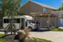 Charming residential area with a convenient bus stop, showcasing a community shuttle and welcoming atmosphere.