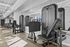 Modern fitness center featuring state-of-the-art exercise machines and sleek contemporary design.
