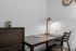 Chic and cozy home office nook with a modern desk, sleek lamp, and stylish decor accents.