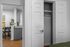 Bright apartment showcasing a sleek modern kitchen with granite countertops and an inviting dining area, enhanced by stylish decor.