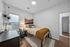 Cozy, modern bedroom with stylish decor, featuring a comfortable bed, elegant wall hanging, and chic desk setup.