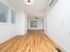 Bright and airy apartment with sleek hardwood floors and large windows for abundant natural light.