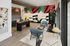 Contemporary apartment space featuring modern decor, vibrant mural art, and stylish seating area with natural lighting.