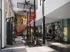 Modern and stylish gym with state-of-the-art equipment, colorful graffiti walls, and abundant natural light.