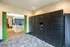 Modern apartment lobby featuring sleek Luxer One package lockers and a stylish office area with contemporary design.
