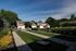 Charming suburban homes with manicured lawns and lush greenery, perfect for serene living.