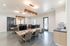 Modern co-working space with sleek computers, chic lighting, and a bright, inviting atmosphere.