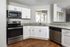 Kitchen with white cabinets and granite countertops