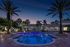Pool at dusk with clubhouse views